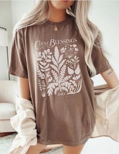 Botanical Wildflower Blessings Thanksgiving Shirt ♥ All shirts from Diligently Devoted are handmade-to-order, just for you ♥ Unisex sizing- Shirts are Unisex Sizing, Comfort Colors introduces its garment-dyed t-shirt; a fully customizable tee made 100% with ring-spun cotton. The soft-washed, garment-dyed fabric brings extra coziness to your wardrobe while the relaxed fit makes it an excellent daily choice. The double-needle stitching throughout the tee makes it highly durable while the lack of s God Shirts, Glory To God, Thankful Shirt, Thanksgiving Shirt, Thanksgiving Shirts, Dyed Fabric, Christian Shirts, Cricut Ideas, God Is Good