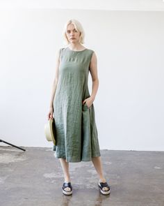 "Our endlessly romantic moss green maxi dress - representation of simplicity and magnificence. This dress is tailored from Lithuanian washed linen fabric and comes with matching belt to extenuate the waistline. FABRIC: 100% softened Lithuanian linen COLOR: Please choose the color from the side menu. STYLE: Maxi sleeveless dress with side pockets, comes with matching belt. Features fold at the back. If you need other style, length, sleeves length or color, please contact us. SIZE CHART: 2 US/ 6 A Dresses For Woman, Maxi Dress With Belt, Green Linen Dress, Sleeveless Linen Dress, Long Linen Dress, Dress Linen, Linen Maxi Dress, Linen Style, Dress With Belt