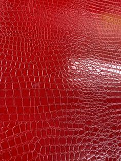 red leather textured with crocodile skin