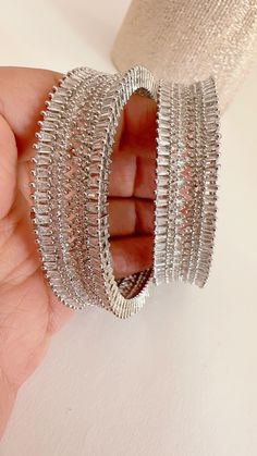 Rhodium Finish American Diamond/CZ Bangles/Bracelet/Indian Party Wear Bangles/ CZ stone bangles/Indian wedding/bridal jewelry Plating-Rhodium Finish Opening :Not a  Screw type It is made by our artisans using expert techniques, so it sparkles and shines over the years. Best gift option for your loved ones comes in an exquisite gift box. Wedding Hoop Earrings With Bling And Cubic Zirconia, Party Silver Diamond Cut Bracelet, Silver Hoop Earrings With Bling For Wedding, Silver Bling Hoop Earrings For Wedding, Diamond Cut Bangle Bracelets For Party, Party Bangle Bracelet With Diamond Cut, Silver Hoop Jewelry With Hand Set Details, Silver Bangle With Diamond Accents For Party, Silver Diamond Hoop Earrings With Bling