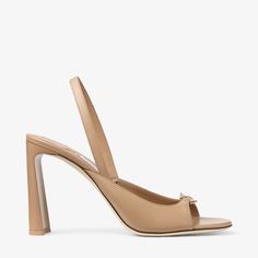 Designed to a modern, graphic silhouette, the Lev sandal is crafted from Nappa leather. Featuring a curved heel, this elevated sandal is complemented by gold-tone Diamond hardware. Graphic Silhouette, Shoes Luxury, Sneaker Dress Shoes, Simple Outfit, Gold Sandals, Jimmy Choo Shoes, Footwear Design Women, Sneaker Wedge, Designer Boots