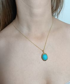 14K Gold pendant features an oval cabochon natural Turquoise gemstone surrounded by a 14K Gold Greek Key design setting.  Pendant hangs from a 1 mm 14K Gold chain. Pendant length 3.6 cm (1.4 inches) Turquoise stone dimension 15 x 10 mm; height 8.8 mm Gold setting thickness 1 mm Gold weight 3.80 grams Chain length 45 cm (17.7 inches), 1 mm wide Gold weight 1.2 grams Pendant and chain may be sold separately: Pendant price 265.00 Euros Chain price 65.00 Euros Please contact me Handcrafted - one of Elegant Turquoise Cabochon Pendant Necklace, Elegant Turquoise Cabochon Necklace, Yellow Gold Oval Cabochon Gemstones, Gold Oval Turquoise Gemstone Necklace, Elegant Gold Turquoise Necklace With Oval Pendant, Elegant Oval Turquoise Necklace As Gift, Elegant Oval Turquoise Necklace Gift, Elegant Oval Turquoise Necklace For Gift, Elegant Yellow Gold Turquoise Necklace With Cabochon