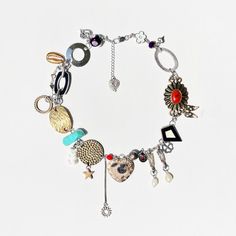 a bracelet with charms and other items on it