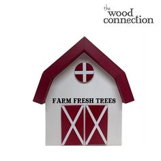 a red and white building with the words farm fresh trees on it