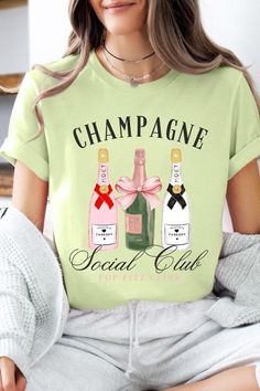 Champagne Social Club Graphic T Shirts.Unisex Crew Neck Short Sleeve Tees.Crafted from premium materials, tailored to your lifestyle, ensuring a comfortable fit for any occasion.Family Group Uniforms Birthday Party Gift Concert Festival Events.High Quality Direct To Film Printed Graphic Design.100%COTTON,HEATHER(52%COTTON,48%POLY),ATH.HEATHER,BLACK HEATHER(90%COTTON,10%POLY)NICARAGUAMade In: Nicaragua Spring Party Tops With Text Print, Spring Party Graphic Print T-shirt, Trendy Funny Print T-shirt For Parties, Trendy Slogan Tops For Party, Trendy Party Tops With Slogan, Casual Slogan Tops For Party, Casual Party Tops With Slogan, Trendy Party T-shirt With Letter Print, Casual Party T-shirt With Text Print