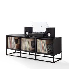 an entertainment center with record players, speakers and records on it's sides in front of a white background