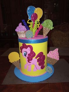 a cupcake cake decorated to look like a pony