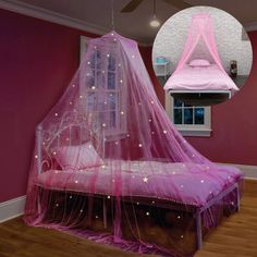 a bed with a pink canopy over it