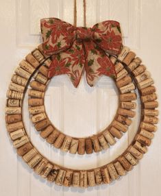 a wreath made out of wine corks with a bow