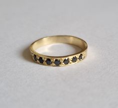 Handmade delicate Black Onyx, half eternity stacking ring, stoned with 7 beautiful shiny Onyx, diamond shaped faceted gemstones. This multistone eternity ring is beautiful alone or stacked together with other rings and is delicate and pretty on your finger. The ring is available in nickel free, 14k gold plating over brass or silver base as well as, solid silver or 9k and 14k solid gold- yellow, white or rose gold. A perfect engagement ring or just a beautiful gift for you. Gemstones alternative Onyx Band Ring, Black Onyx Diamond Ring, Black Onyx Gold Ring, Minimalist Stackable Black Rings, 14k Gold Black Round Band Jewelry, Black 14k Gold Round Band Jewelry, Black 14k Gold Band, Black Fine Jewelry Rings For Everyday, Timeless Black Stackable Jewelry