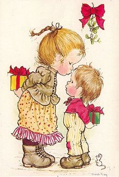 two children are kissing each other while holding presents