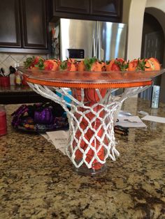 a basket filled with strawberries on top of a counter