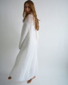 Hello, I'm the one, who won't let you down - white mohair long cardigan. I will comfort you, keep you warm and will make you smile. I'm 100% hand made and proud of that. I consist of 70% kid mohair and 30% of nylon, which makes me incredibly natural. I'm quite unique as could be worn all year long. I'm in one size and one size fits all because my measurements are : ❤️ Width -52 cm ❤️ Lengths -123 cm If you would like me in other size, you could request a custom order with your own parameters, so White Soft Winter Cardigan, White Soft Texture Cardigan For Winter, White Soft Texture Winter Cardigan, White Chunky Knit Sweater Coat For Winter, White Long Soft Knit Sweater, Long White Soft Knit Sweater, White Mohair Outerwear For Winter, White Mohair Winter Outerwear, White Long Cardigan For Winter