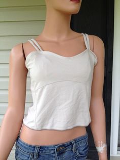 THIS TANK TOP IS NEW WITH TAGS!! NEVER WORN OUTSIDE, ONLY DISPLAYED IN A MAJOR DEPARTMENT STORE. PLEASE SEE ALL OF THE PICTURES BEFORE BIDDING! NEW BALANCE WOMEN'S DOUBLE STRAP TANK TOP NEW!! COLOR- TAN / BEIGE / OFF WHITE SIZE- MEDIUM  Support when you need it most. Feature double adjustable straps and built in shelf bra. Crop cut, sweetheart neckline. 90% polyester, 10% spandex Approximate measurements: bust 30", length (armpit to hem) 10" Please look at all pictures, use zoom option if needed Y2k Style Fitted Camisole With Built-in Bra, Spring Cami Top With Built-in Bra, Casual Tops With Built-in Bra And Spaghetti Straps, Casual Crop Top With Built-in Bra And Medium Support, Casual Crop Tank Top With Built-in Bra, Y2k Tops With Spaghetti Straps And Built-in Bra, Y2k Tank Top With Built-in Bra, Casual Tank Top With Built-in Bra And Medium Support, Y2k Sleeveless Top With Built-in Bra