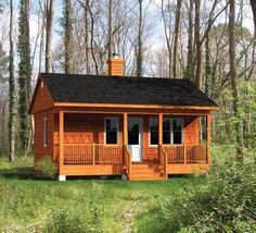 a small wooden cabin in the woods