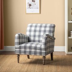 a plaid chair sitting in front of a book shelf