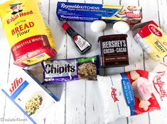 an assortment of food items laid out on a white wooden surface with the words, healthy foods