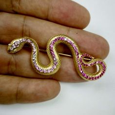 For Sale on 1stdibs - Pink Sapphire Diamonds 18 Karat Yellow Gold Snake Brooch Just take a look on this hi-detailed Brooch, distributes all the wisdom of the Snake. Carefully Snake Brooch, Sculptural Jewelry, Snake Jewelry, Steampunk Clothing, Emo Fashion, Gold Snake, The Snake, Gothic Girls, The Wisdom