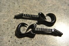 two black hair clips sitting on top of a counter