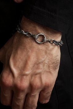 My unique take on a Claddagh, this men’s chain link bracelet features two hands grasping a ring. Meticulously handcrafted from 925 Sterling Silver, the bracelet is symbolic of friendship for a meaningful piece of jewelry. The round chunky links, hands and circle are all softly brushed to add a textural element and then I add a black oxide finish to slightly darken the silver for an antiquated appearance. Looks wonderful on its own or paired with other silver bracelets or a watch. Lobster clasp c Oval Link Stainless Steel Bracelets With Polished Finish, Stainless Steel Oval Link Bracelets With Polished Finish, Polished Stainless Steel Oval Link Bracelets, Masculine Everyday Silver Jewelry, Metal Chain Bangle Bracelet With Polished Finish, Classic Metal Bracelets With Oxidized Finish, Adjustable Link Chain Bracelet With Hook And Links, Adjustable Link Chain Bracelet With Hooks, Adjustable Chain Link Bracelet With Hooks