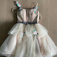 Beautiful Tulle Beige/Pink Mini Dress With Corset Top And Floral Accents! Included Is Also A Tie-Up Lace In The Back And A Silver Bow In The Front! Size 2 M, Used Once For A Bat Mitzvah And In Great Condition! Originally Purchased From Designer On Etsy. Beige Tulle Dress, Dress With Corset Top, Dress With Corset, Pink Mini Dress, Silver Bow, Pink Mini, Pink Mini Dresses, Pink Beige, Bat Mitzvah