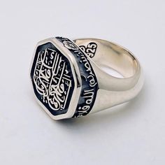 Elevate your jewelry collection with this exquisite Sterling Silver Ring that can be personalized with a sacred Ayat from the Holy Quran or any meaningful phrase of your choice. Meticulously handcrafted, this ring embodies both elegance and deep personal significance, making it a cherished accessory for daily wear or special occasions. ★ Product Information * Gender : Male * Material : 925 Sterling Silver * Total weight : 24 to 34 Grams *  Customization: Engrave your favorite Quranic Ayat or any Quranic Ayat, Engraved Silver Ring, Islamic Jewelry, Handmade Silver Ring, Silver Engraving, Holy Quran, Silver Rings Handmade, Gift Handmade, Rings Statement