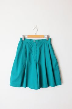 "Vintage Teal Green High waist Pleated Shorts. Measurements Length           : 20\" Waist             : 27-28\" Hips               : 42\" Inseam          : 8\" Rise               : 13\" Condition    : Gently used, there's no stains or holes. Good condition. ※Please read the policy before you purchase※" Retro Wide Leg Cotton Shorts, Retro Green Shorts, Vintage Short Cotton Pants, Vintage Cotton Short Pants, Retro Short Bottoms With Elastic Waistband, Vintage Fitted Bottoms With Elastic Waistband, Vintage Fitted Bottoms With Short Leg, Vintage Short Pants For Spring, Retro Relaxed Fit Short Leg Bottoms