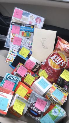 a bunch of notes and food in a car