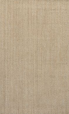 a close up view of a beige rug with herringbones on the bottom and sides