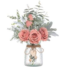 a vase filled with pink roses and greenery