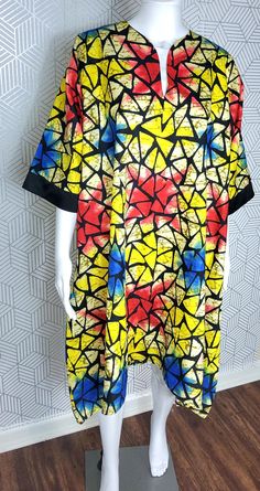 This beautifully crafted kaftan dress features a colorful colorblock pattern, with asymmetrical Ruffles sleeves and a unique button accent. The dress has a round neckline and is closed with a button, making it perfect for a variety of occasions such as travel, weddings, parties, casual or formal events, and workwear.  The dress is made from high-quality polyester material, which is machine washable for easy care. It's available in size M, and L and is handmade, perfect for women who appreciate u Oversized Multicolor Patchwork Dress, Multicolor Printed Short Sleeve Kaftan, Printed Multicolor Summer Tunic, Casual Multicolor Short Sleeve Kaftan, Casual Multicolor Tunic For Summer, Summer Multicolor Printed Tunic, Casual Multicolor Summer Tunic, Oversized Multicolor Printed Dresses, Casual Multicolor Dresses With Kimono Sleeves