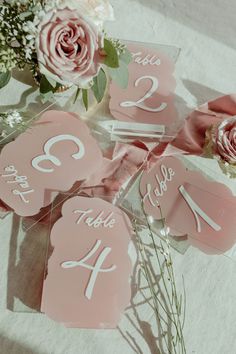 wedding table numbers and flowers on the table