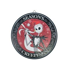 a clock with a skeleton on it that says season's greetings