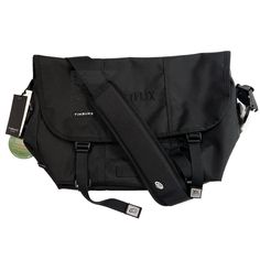 Timbuk2 Netflix Classic Messenger Bag Eco Black Daily Use Flap Bags With Dust Bag Included, Black Rectangular Camera Bag With Large Capacity, Large Capacity Black Rectangular Camera Bag, Urban Bag With Removable Pouch, Black Flap Shoulder Bag With Adjustable Strap, Black Shoulder Bag With Adjustable Strap And Flap, Satchel Bag With Removable Pouch For Commuting, Urban Crossbody Bags For On-the-go, Functional Black Laptop Bag For Daily Use