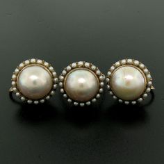 You are looking at a beautiful, antique, mabé pearl ring & earrings set. The set is crafted in solid 10k rose gold and it still has its original patina preserved which can be polished to like new if desired. The design shows the mabé pearl bezel set in the center of the setting surrounded with a prong set seed pearl bezel on all 3 pieces. We can sell you any piece individually if you desire. Enjoy! -- Item Details -- Material: 10k Solid Rose Gold Weight: 18.3 Grams -- Stone(s): (3) Natural G Seed Pearl Ring, Mabe Pearl, Seed Pearl, 14k Gold Ring, Pearl Ring, Antique Victorian, Design Show, Earrings Set, Earings Piercings