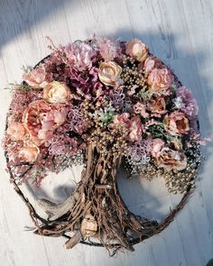 a tree that has been made out of branches and flowers