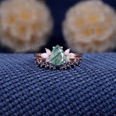 a close up of a ring on a blue cloth