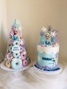 two cakes decorated to look like princesses and donuts are sitting on top of each other