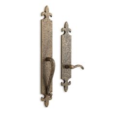 two antique style door handles on a white background