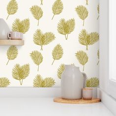 the wallpaper in this kitchen is designed to look like palm leaves