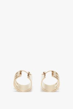 The house’s signature Frame detail elevates these gold-plated brass hoop earrings. Exquisitely crafted in Italy and engraved with the Victoria Beckham logo, they have a latch back closing for a secure and comfortable fit. Designed to elegantly frame the face, they are a wear-anywhere accessory. Customer Note: Due to our hygiene policy, this item is non-refundable. Styled with the Exclusive V- Neck Gathered Waist Floor Length Gown In Ivory  Victoria Beckham Exclusive Frame Hoop Earrings In Gold Brass Hoop Earrings, Brass Hoops, Floor Length Gown, Earrings In Gold, S Signature, Victoria Beckham, Floor Length, The Face, The House