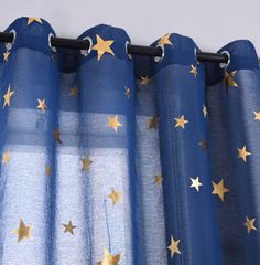 blue and gold curtains with stars on them