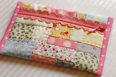 a close up of a patchwork wallet on a table