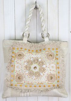 The perfect boho beach bag is here! This beautiful, one-of-a-kind tote bag features unique seashell and beaded details, a bohemian fringe border, and twisted rope handles. Take this beautiful tote bag to the beach, or use it as a fashionable carry-on on your next adventure. FINAL SALE Twisted rope handles Seashell details Beaded details Style: DR-3468 Dimensions: 22" x 17" Bohemian Beaded Beach Bag For Summer, White Hobo Bag For Beach Season, White Hobo Bag For The Beach, White Hobo Bag With Braided Handles For The Beach, Beaded Crochet Rectangular Bag For Beach, Bohemian Beige Beach Bag With Braided Handles, Cream Hobo Shoulder Bag For Beach, Beaded Beach Bags For Beach Season, Bohemian White Bag For Vacation