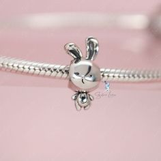 This is charm only, bracelet is sold separatelyIndulge in the adorable charm of our sterling silver rabbit bead charm! Made with solid 925 sterling silver and coated in platinum, these charms are guaranteed to be sturdy and intricately designed. Whether you're adding to your current charm bracelet or starting a new one from our collection, these charming bunny animal charms are a must-have for any lover of cute and stylish jewelry. Material: 925 sterling silverFinish: platinum plateDimension: 0. Silver Bunny Design Jewelry For Gifts, Silver Bunny Design Jewelry Gift, Cute Silver Charms For Gifts, Cute Silver Dangle Charms, Silver Jewelry With Bunny Design For Gift, Rabbit Charm, Cute Rabbit, Stylish Jewelry, Sterling Silver Charm