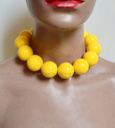 jewelry: big yellow beaded necklace --Very large yellow necklace bead material:  Acrylic clasp: stainless steel lobster clasp and a 2 inches adjustable chain Diameter: 30mm Shape : round  Luster: High body: clean Necklace length:  choose colour: 30 mm yellow beads Packing:Beautiful Pouch If you want to order of different style. Please feel free contact me . Thank you .  back to my store: https://www.etsy.com/shop/goodglasspearl?ref=l2-shopheader-name Luxury Yellow Round Beaded Necklaces, Yellow Choker Necklace As A Gift, Yellow Choker Necklace For Gift, Adjustable Yellow Choker Jewelry, Yellow Choker Necklace With Colorful Beads, Retro Adjustable Beaded Necklaces With Round Beads, Adjustable Retro Necklace With Round Beads, Vintage Polished Yellow Beads Jewelry, Vintage Yellow Jewelry With Polished Beads