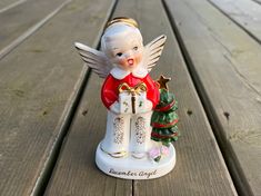 an angel figurine on a wooden table