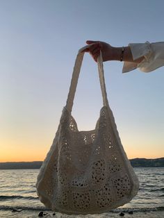 This crochet handbag is completely handmade. Suitable for beach and daily use. White Hobo Tote Bag For Beach, White Tote Hobo Bag For Beach, White Hobo Shoulder Bag For Beach Season, Cream Crochet Bag For Vacation, Cream Hobo Bag For Beach With Large Capacity, Cream Hobo Shoulder Bag For Beach, Lightweight Cream Crochet Bag For Summer, Cream Rectangular Crochet Beach Bag, White Crochet Shoulder Bag For Beach Season