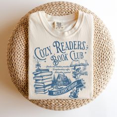 The Cozy Reader's Book Club is perfect for the cozy reading nights in! Grab one today for your favorite teacher or librarian and add a matching mug for 30%! This design is available on Comfort Colors® in the T-Shirt *OR* Sweatshirt in the drop down menu!  🖤 Welcome to our Mama-Owned Bookish Shop! 🖤 Want this design on something else? Reach out to us! We are happy to help.  🖤Comfort Colors: See listing pic for details! 🖤Care Instructions: Turn inside out. Machine wash cold. Tumble dry low. Do not bleach. Do not iron directly on design. 🖤Colors: Please see listing pictures for available colors! This tee is meant to look worn and vintage. 🖤Sizes:  See Size Chart in Listing Pictures. *If you have a question regarding sizing, please contact us before ordering. Sizing issues can not be ref Book Club Snacks, Book Club Shirt, Librarian Shirt, Reading Shirts, Favorite Teacher, Cozy Reading, Club Shirts, Bookish Gifts, Coffee And Books