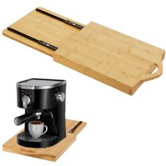 an espresso machine sitting on top of a cutting board next to a coffee maker